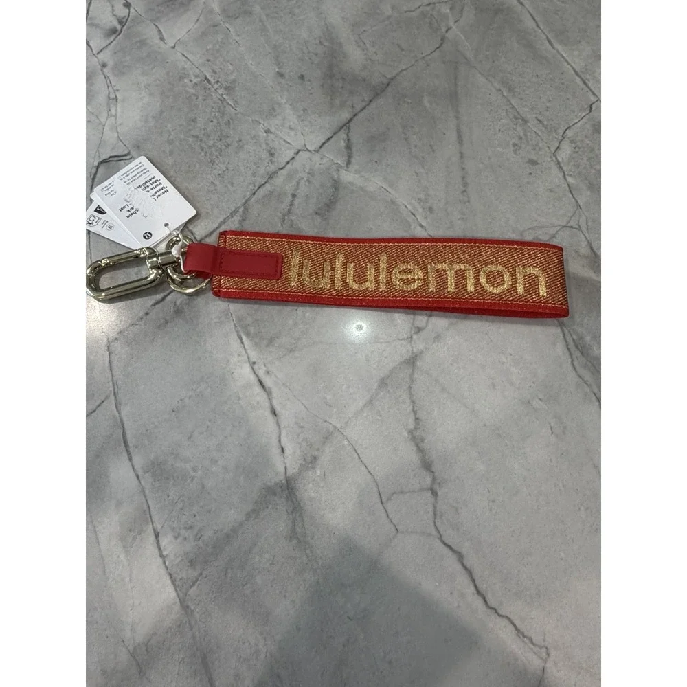 Lululemon Never Lost Wristlet Keychain Logo Detachable Red/Gold One Size